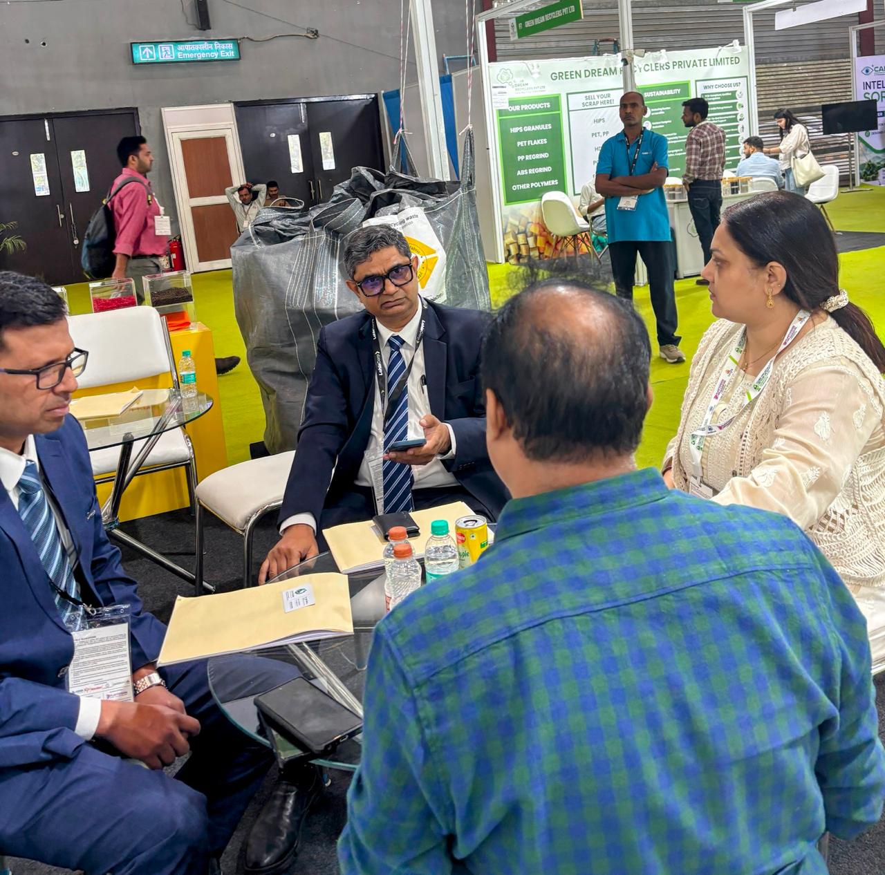 GeoCirculus team in partnership discussions at a recycling exhibition