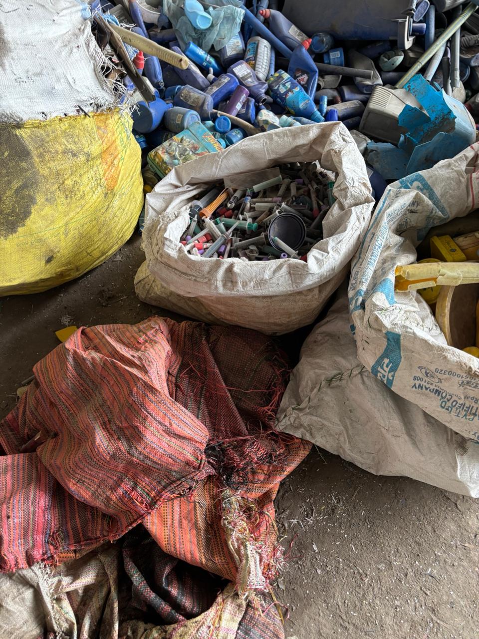Segregated plastic waste streams bagged for scientific processing